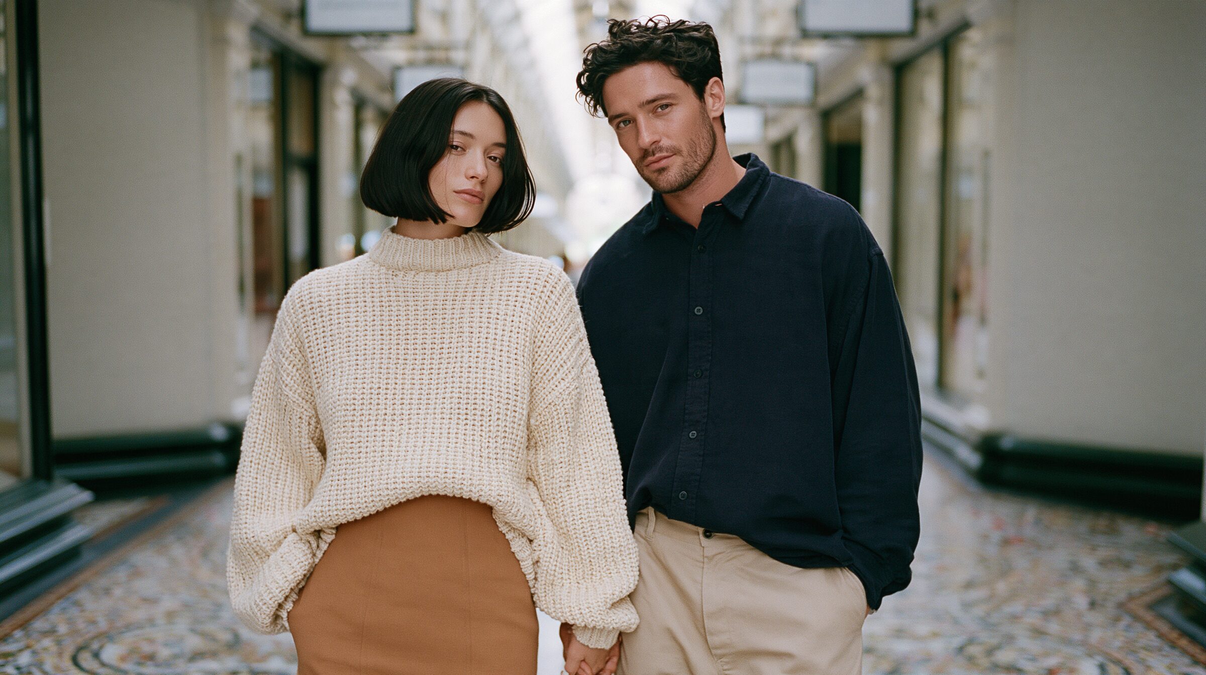 Couple walking hand in hand through the Block Arcade