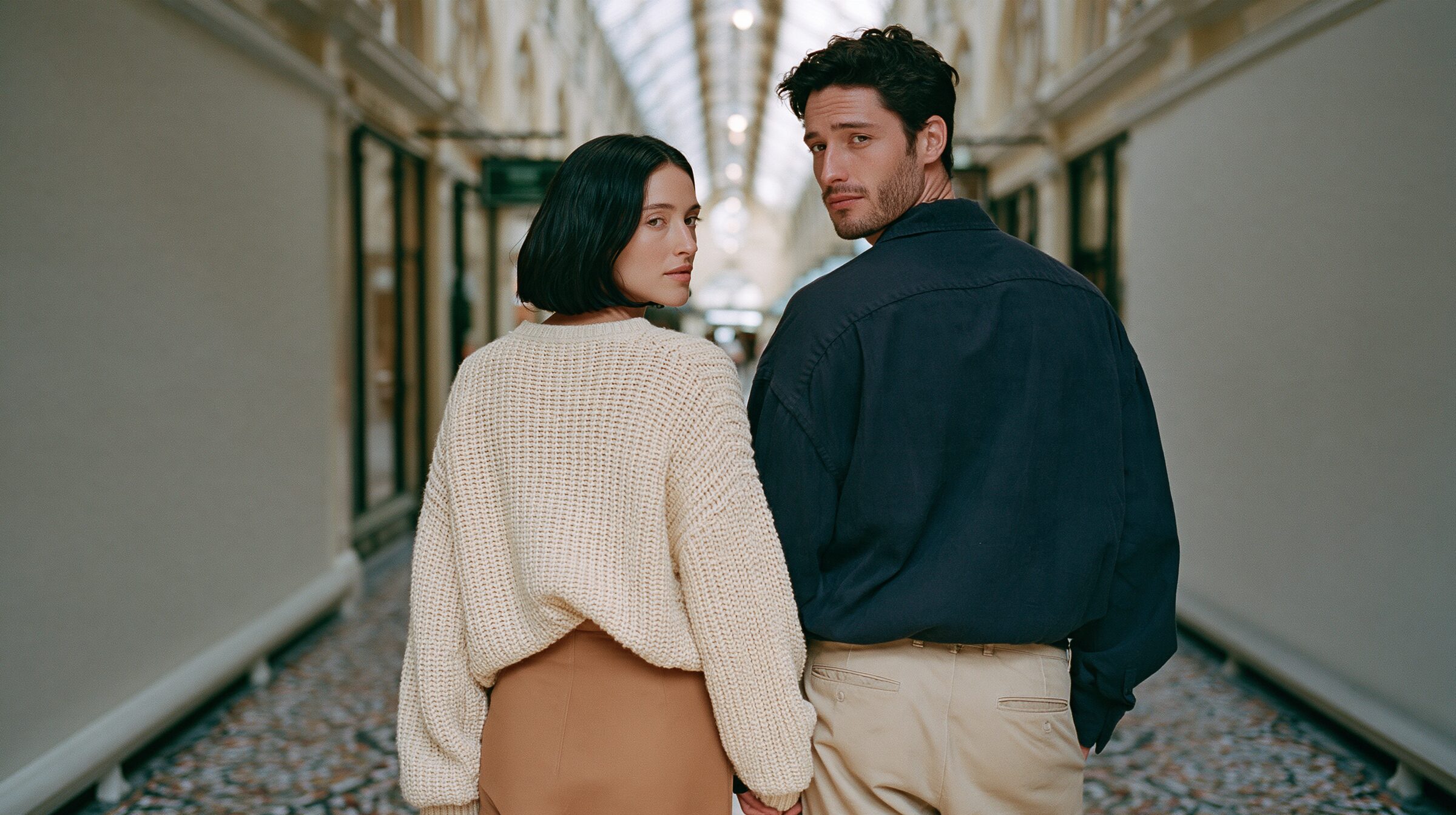Couple walking hand in hand through the Block Arcade